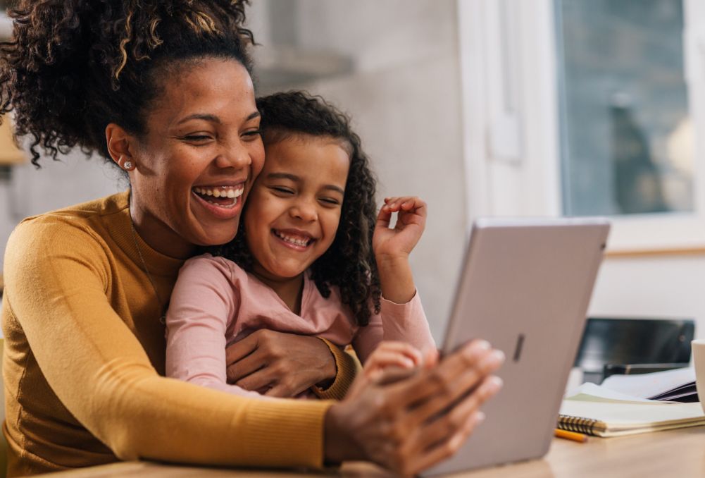 Mother and daughter on computer